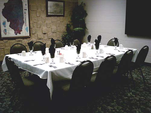 Large square setup with chairs and projector screen